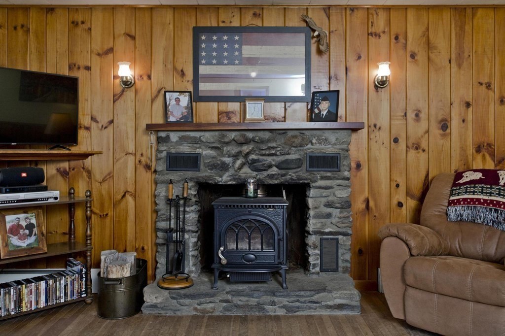 128 S Road Heath, MA 01346 - Photo 13 of 30 a living room with furniture a flat screen tv and a fireplace