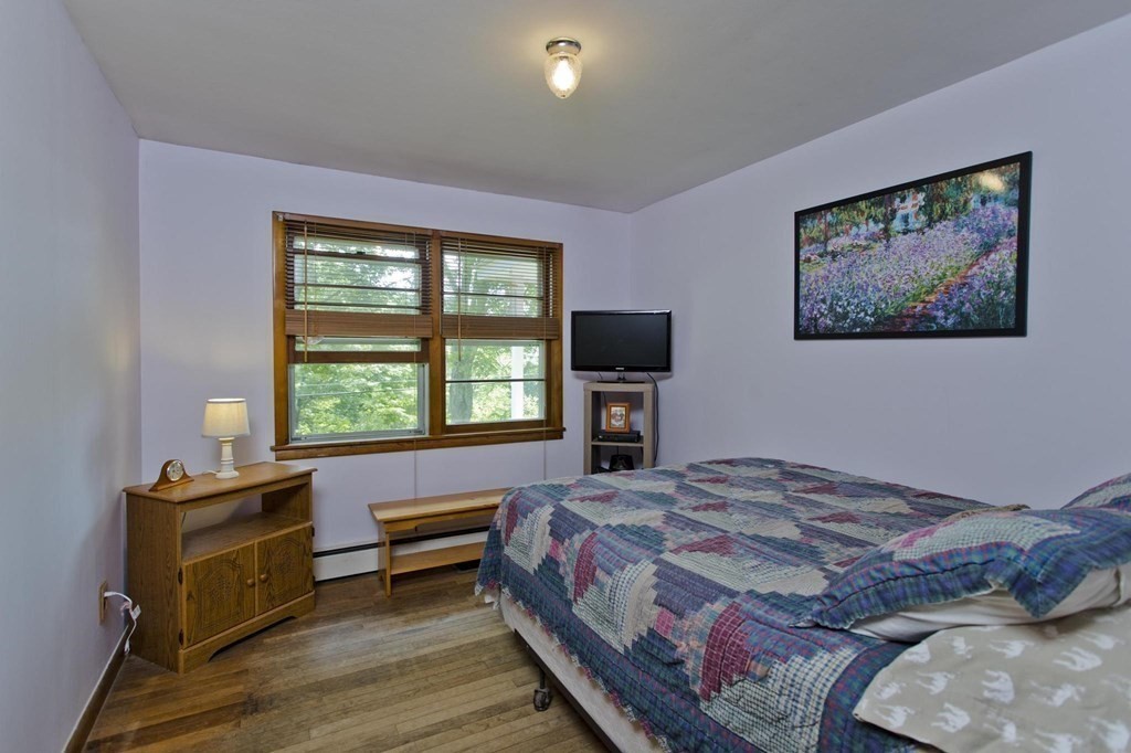 128 S Road Heath, MA 01346 - Photo 17 of 30 a bedroom with a bed and a flat screen tv