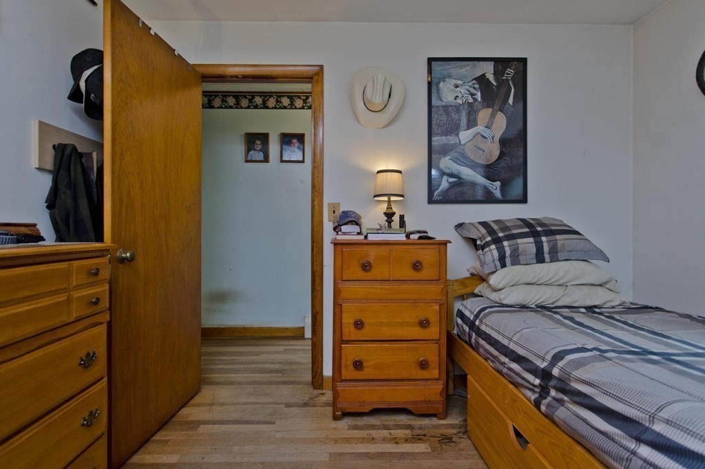 128 S Road Heath, MA 01346 - Photo 22 of 30 a bedroom with a bed and wooden floor