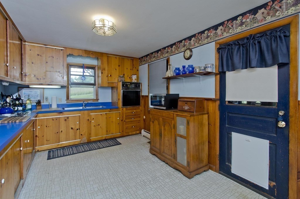 128 S Road Heath, MA 01346 - Photo 8 of 30 a kitchen with stainless steel appliances granite countertop a stove a sink and a refrigerator