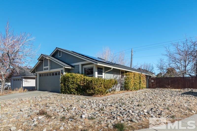 1020 Big Springs Road Reno, NV 89523 - Photo 1 of 17 a front view of a house with a yard