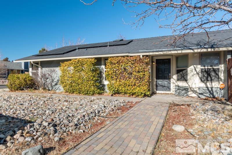 1020 Big Springs Road Reno, NV 89523 - Photo 2 of 17 a front view of a house with a yard