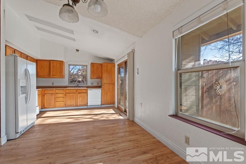 1020 Big Springs Road Reno, NV 89523 - Photo 6 of 17 a view of a kitchen with a sink dishwasher and a refrigerator