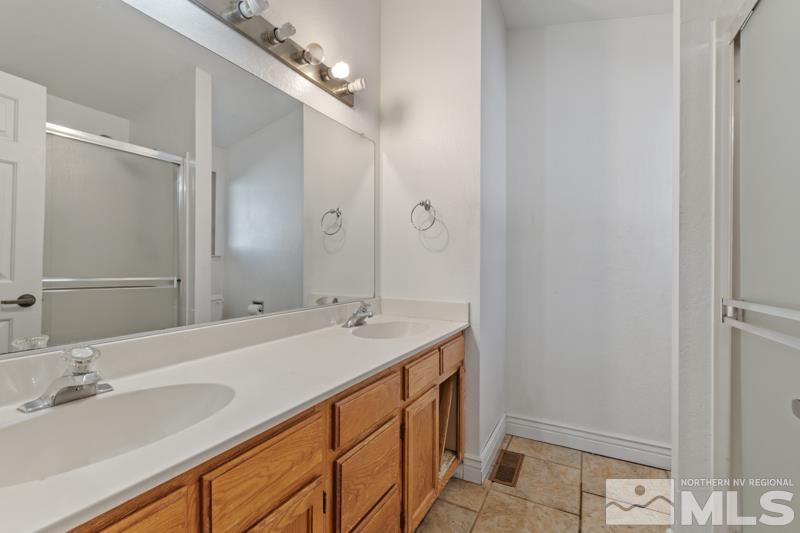 1020 Big Springs Road Reno, NV 89523 - Photo 10 of 17 a bathroom with a sink and a mirror
