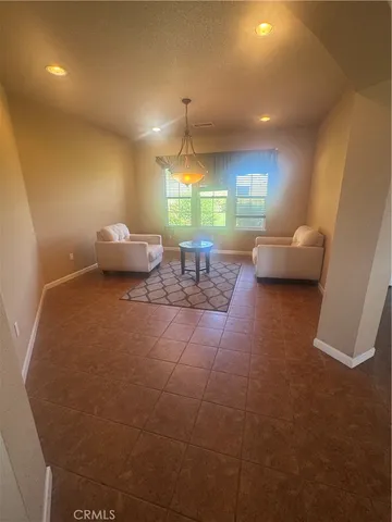 a lobby with furniture and window