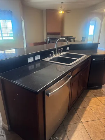 a kitchen with a sink and a refrigerator