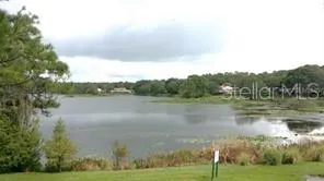 a view of lake with green space