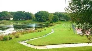 a view of a golf course with a lake view
