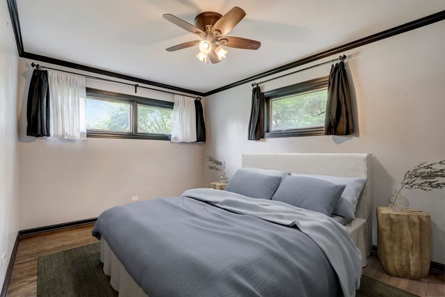 547 East Baldwin Road Palatine, IL 60074 - Photo 13 of 26 a bedroom with a bed and a painting on the wall