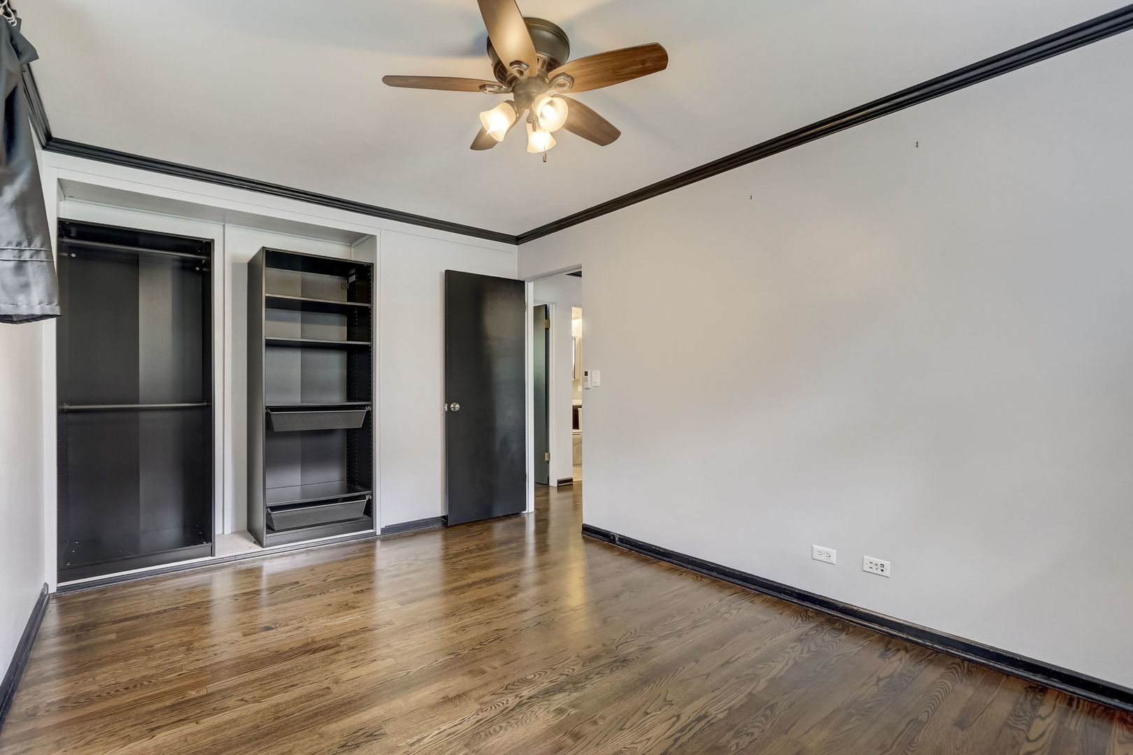 547 East Baldwin Road Palatine, IL 60074 - Photo 15 of 26 an empty room with wooden floor closet and windows
