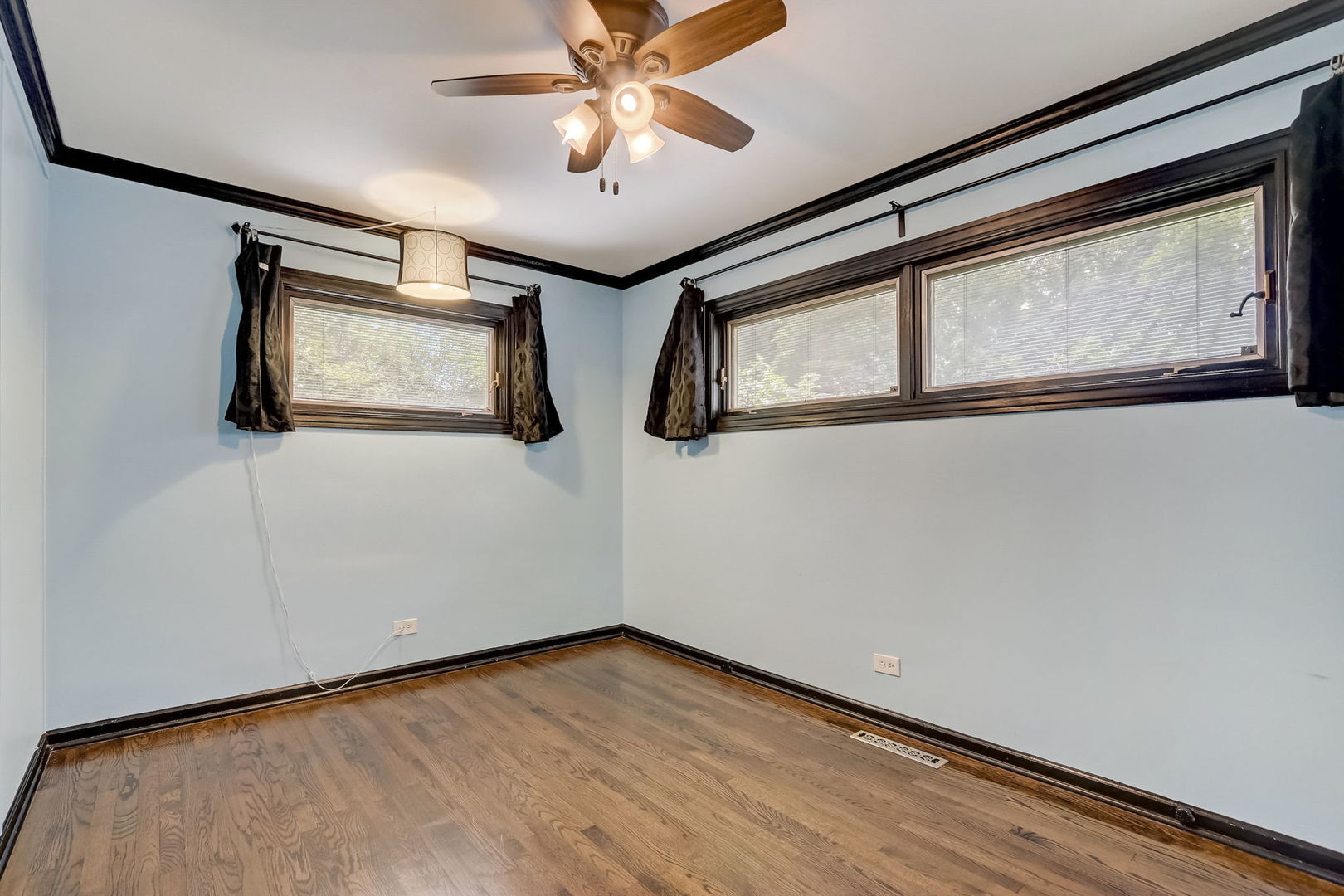 547 East Baldwin Road Palatine, IL 60074 - Photo 18 of 26 a view of an empty room with a window and a ceiling fan