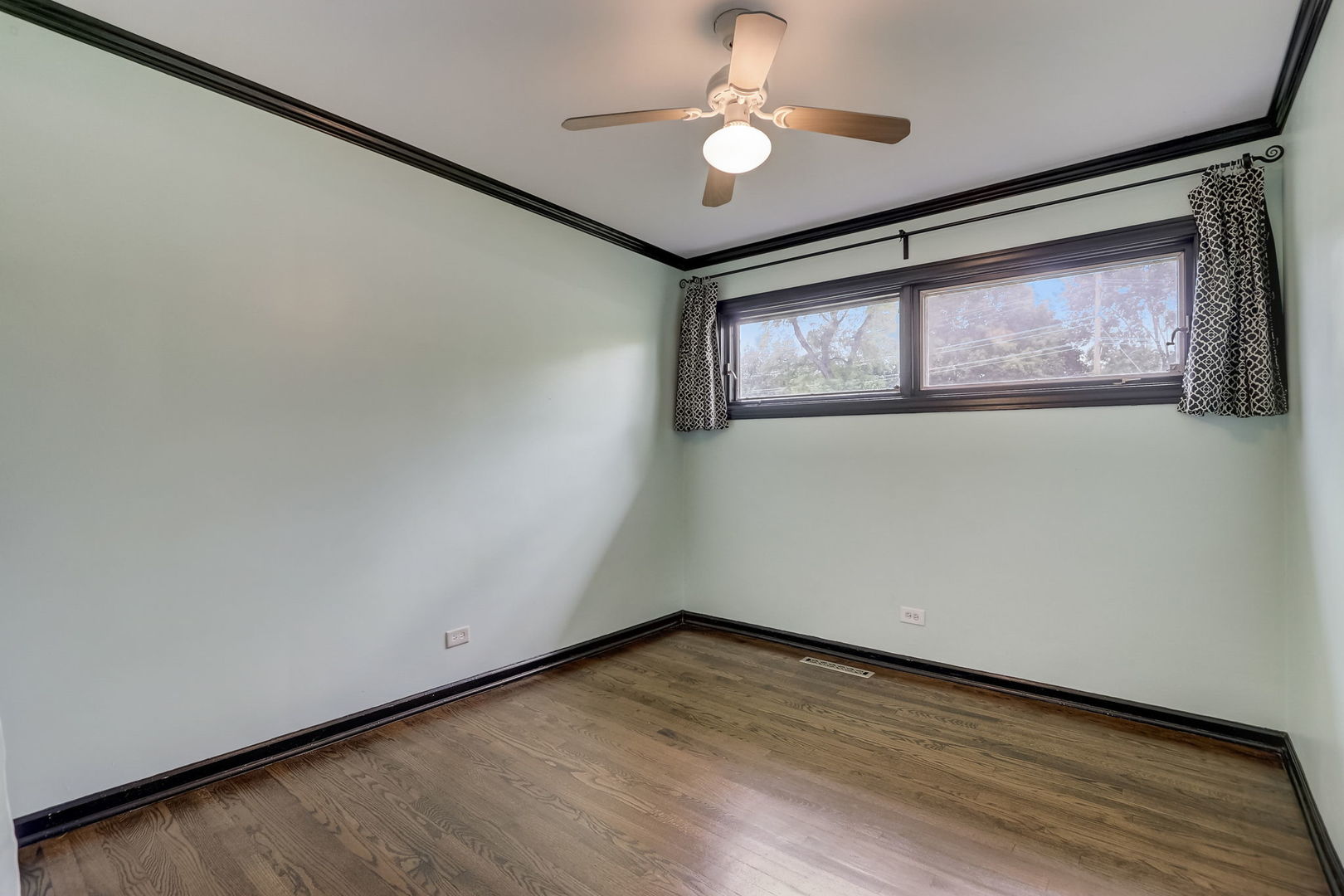 547 East Baldwin Road Palatine, IL 60074 - Photo 20 of 26 an empty room with wooden floor and windows