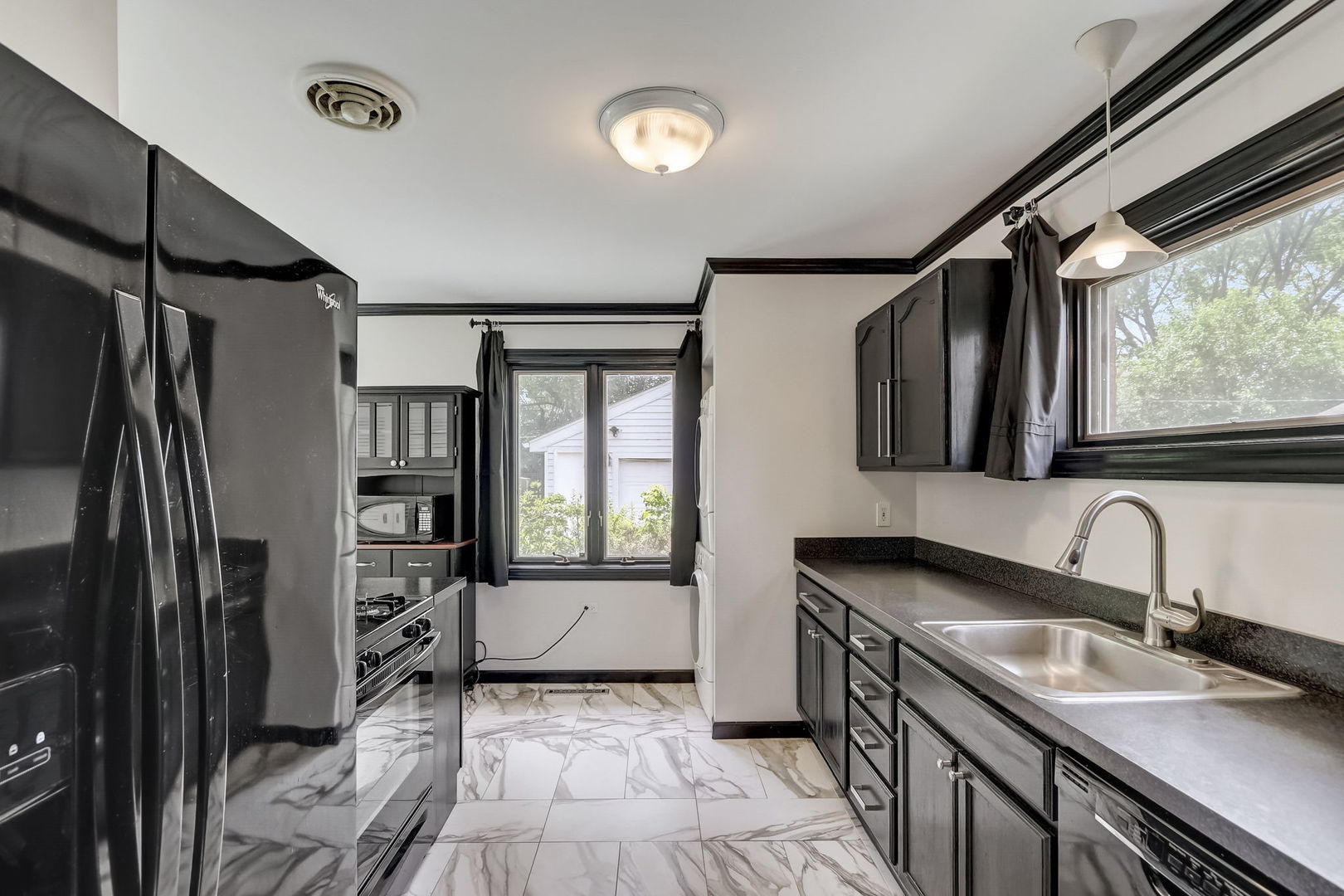 547 East Baldwin Road Palatine, IL 60074 - Photo 8 of 26 a kitchen with stainless steel appliances granite countertop a sink stove and refrigerator