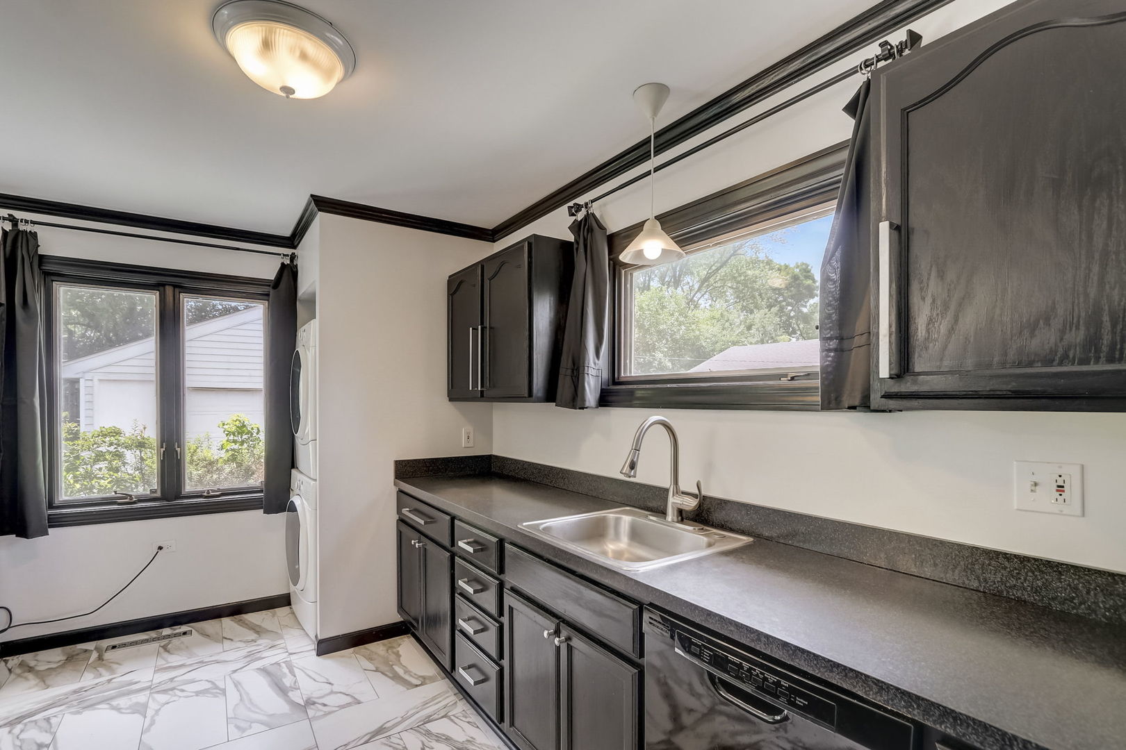 547 East Baldwin Road Palatine, IL 60074 - Photo 9 of 26 a bathroom with a sink and a large mirror next to a window