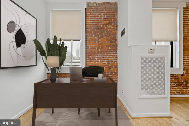 a view of a workspace with furniture