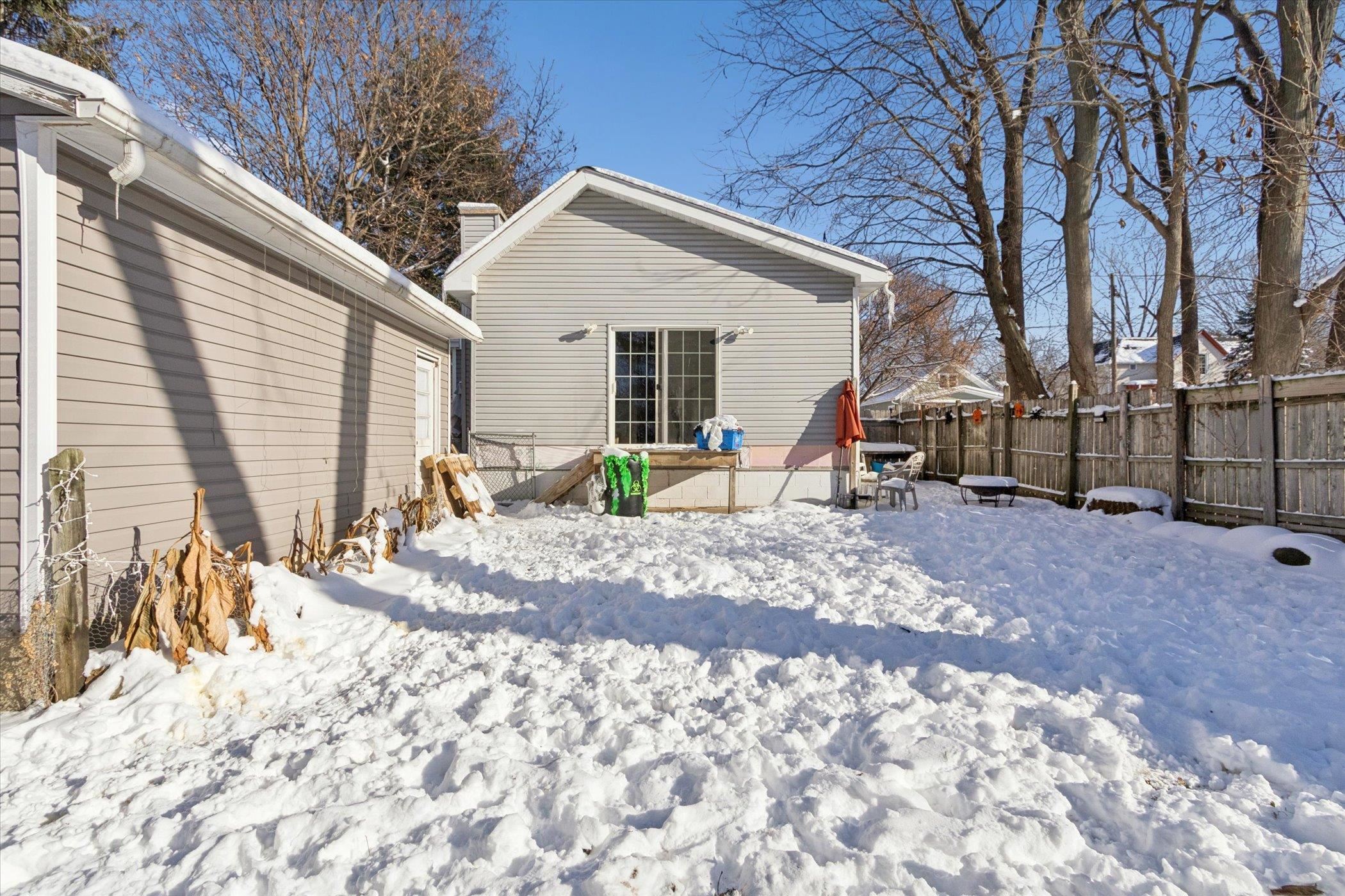 418 Adams Street Rockford, IL 61107 - Photo 18 of 26 a view of a backyard with a patio
