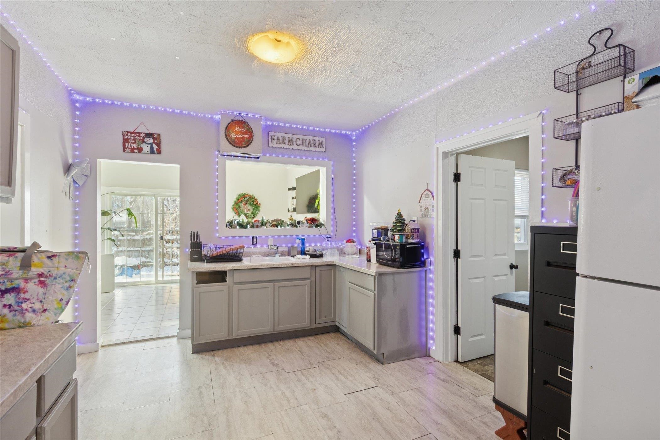 418 Adams Street Rockford, IL 61107 - Photo 6 of 26 a kitchen with a sink cabinets and stainless steel appliances