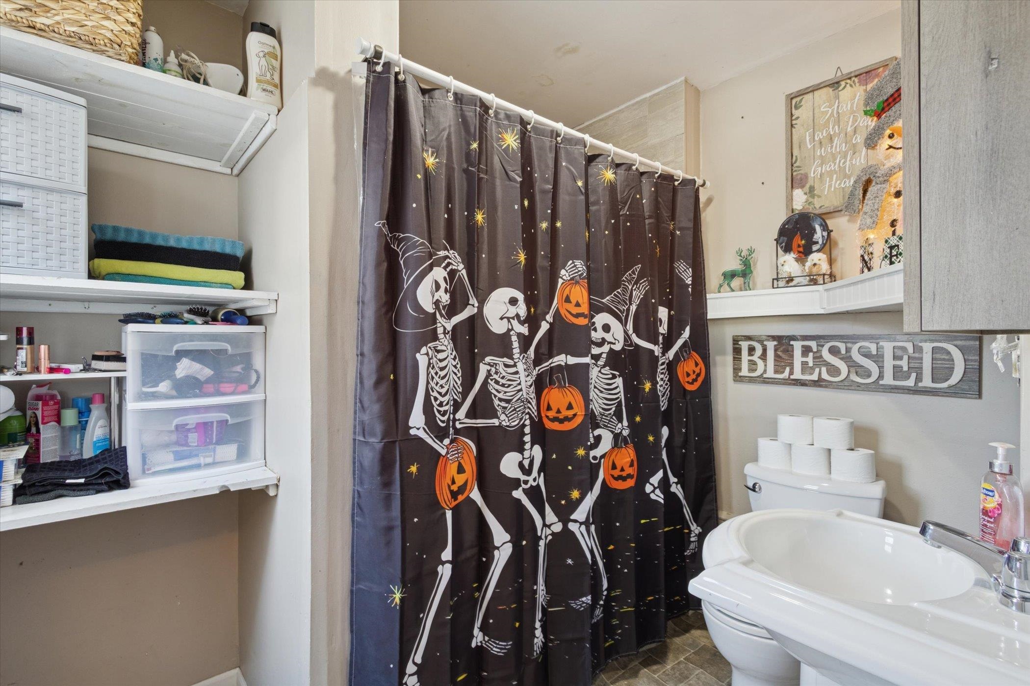 418 Adams Street Rockford, IL 61107 - Photo 9 of 26 a bathroom with a sink toilet and shower