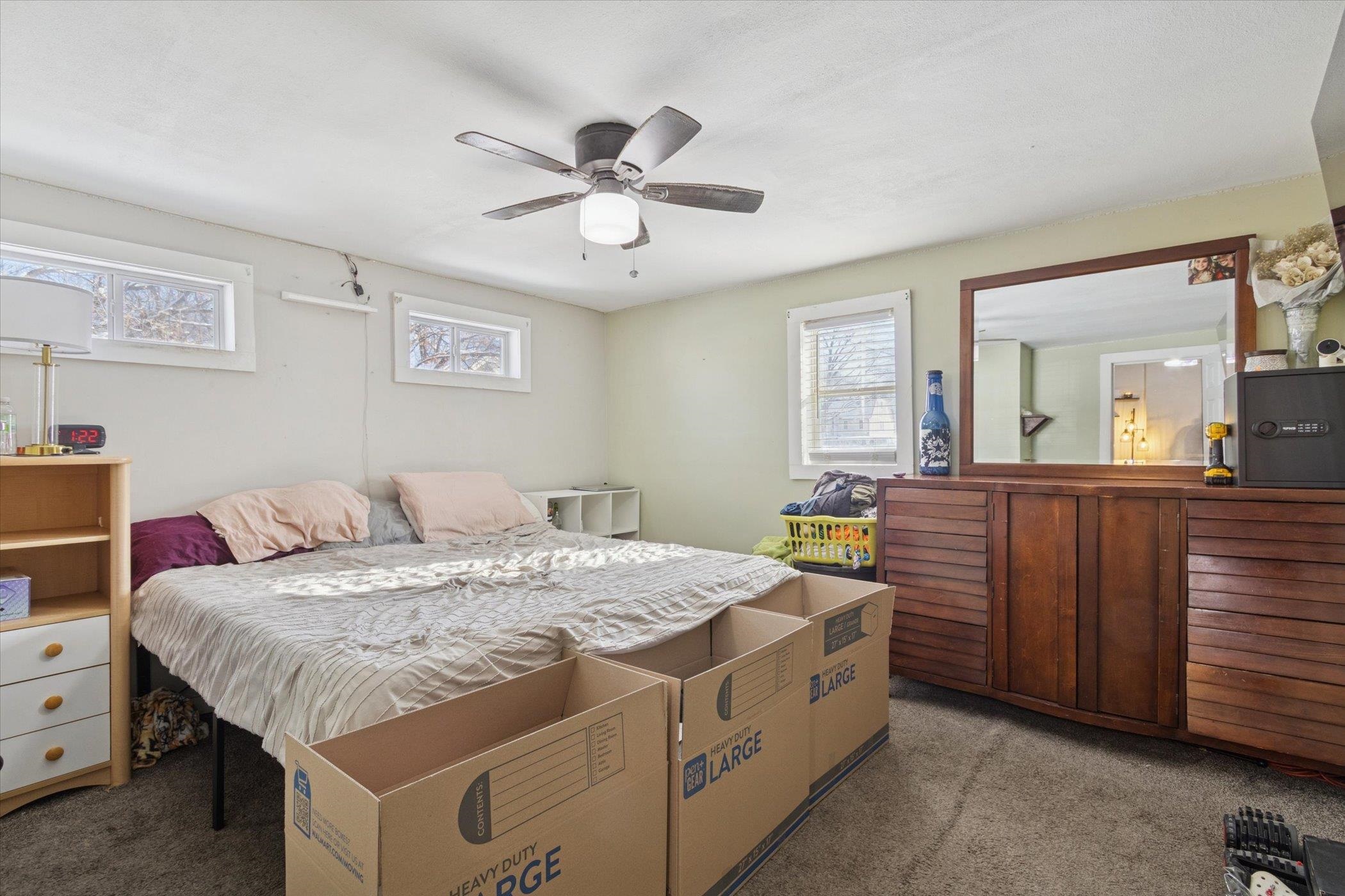 418 Adams Street Rockford, IL 61107 - Photo 10 of 26 a bed room with a bed and a dresser