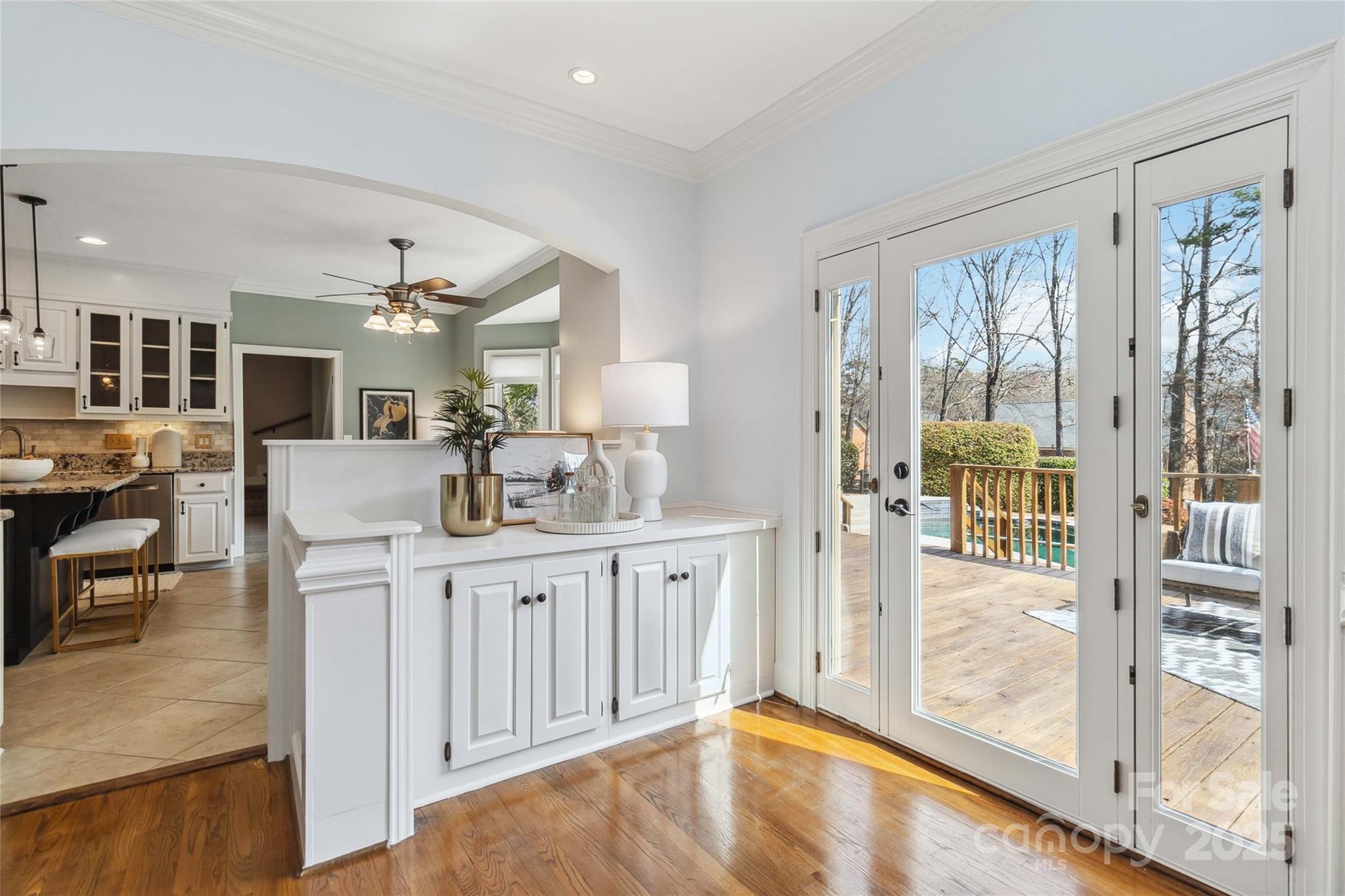 725 Stanhope Lane Matthews, NC 28105 - Photo 12 of 46 a large white kitchen with granite countertop a large window and a view of living room