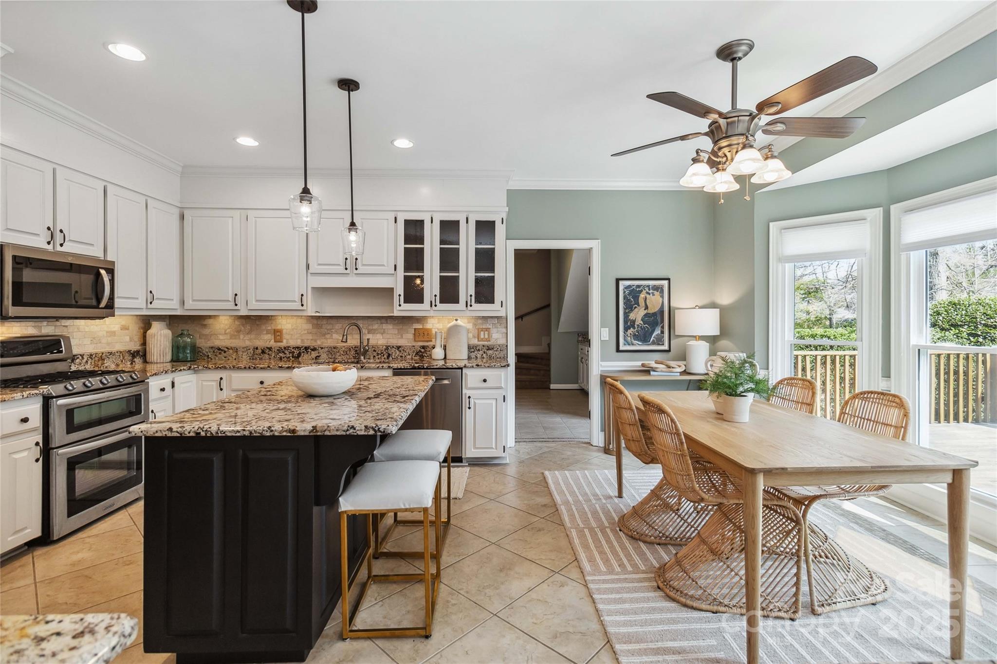 725 Stanhope Lane Matthews, NC 28105 - Photo 13 of 46 a kitchen with kitchen island granite countertop a counter space a sink appliances and cabinets