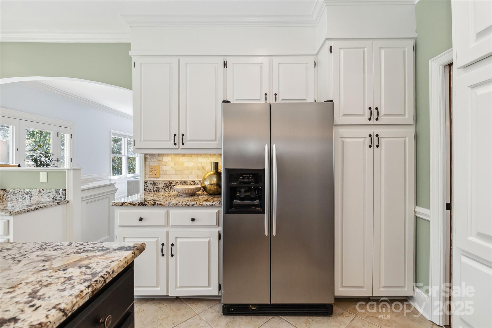 725 Stanhope Lane Matthews, NC 28105 - Photo 17 of 46 a kitchen with granite countertop a refrigerator and a sink