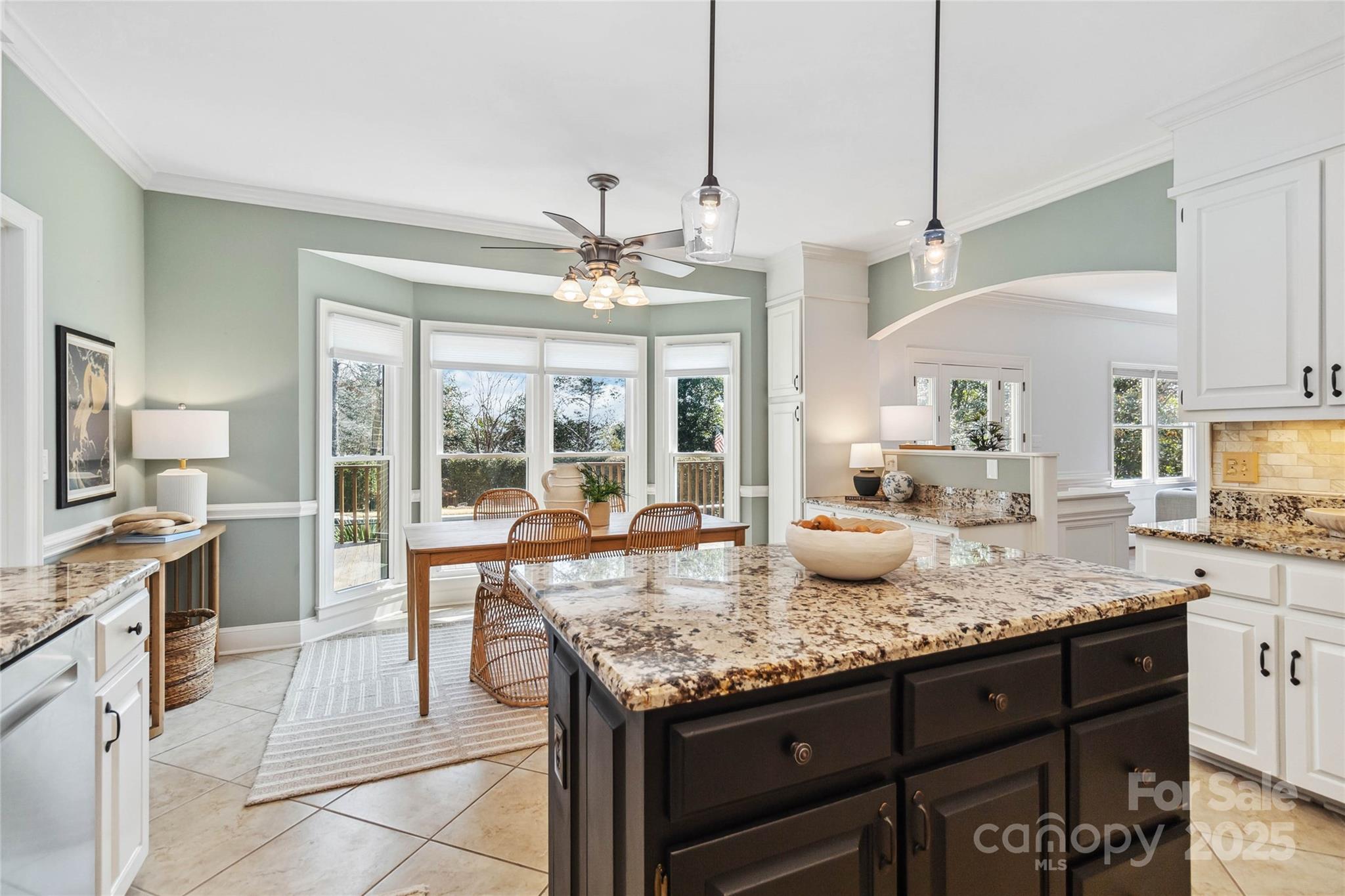725 Stanhope Lane Matthews, NC 28105 - Photo 18 of 46 a kitchen with granite countertop stove sink and refrigerator