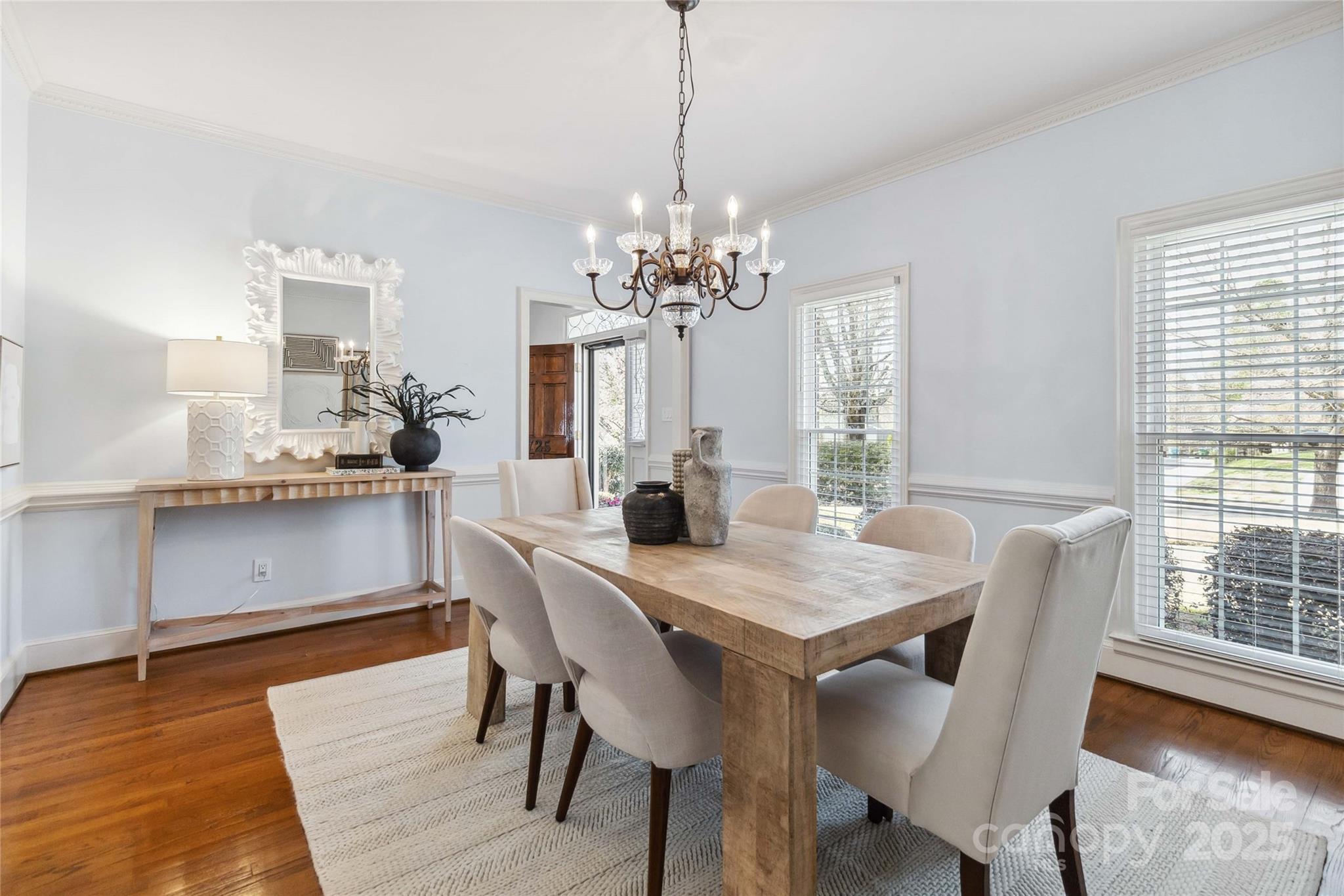 725 Stanhope Lane Matthews, NC 28105 - Photo 21 of 46 a view of a dining room with furniture window and wooden floor
