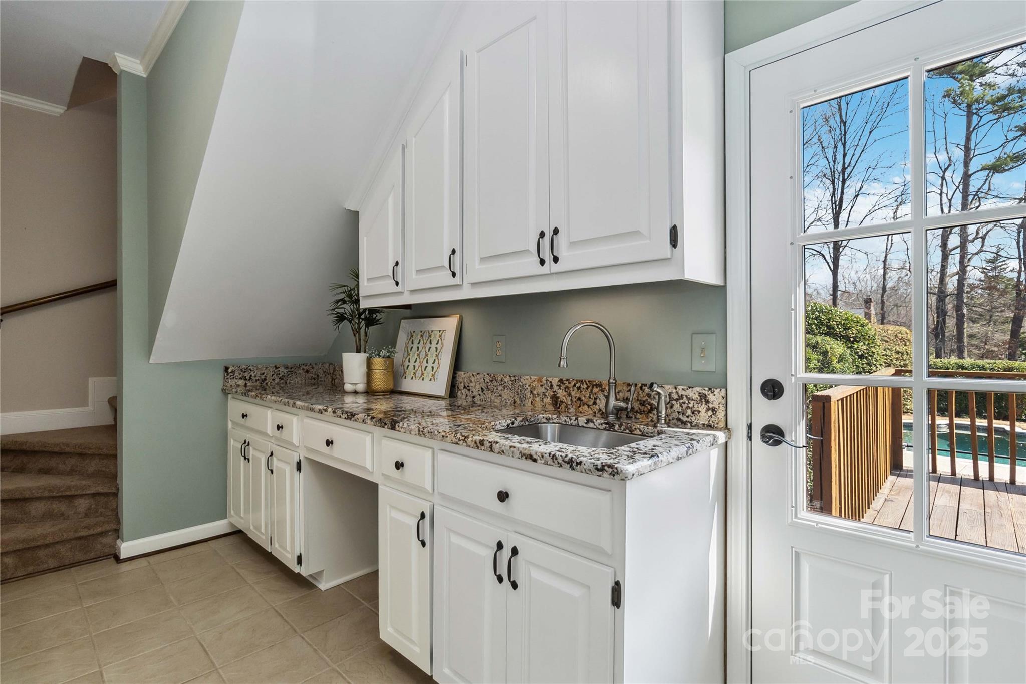 725 Stanhope Lane Matthews, NC 28105 - Photo 22 of 46 a kitchen with stainless steel appliances granite countertop a stove a sink and a white cabinets