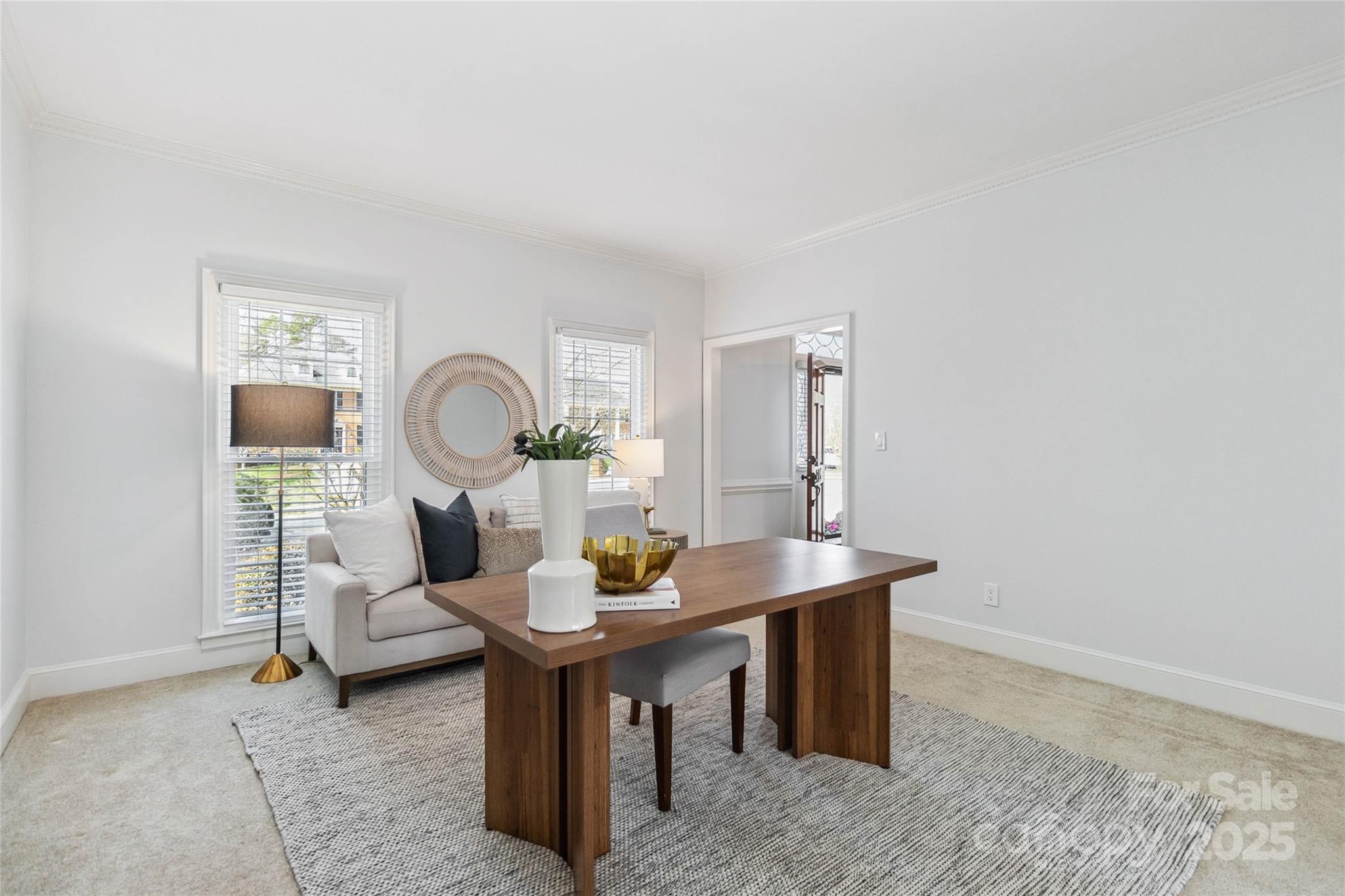 725 Stanhope Lane Matthews, NC 28105 - Photo 23 of 46 a living room with furniture a mirror and a table