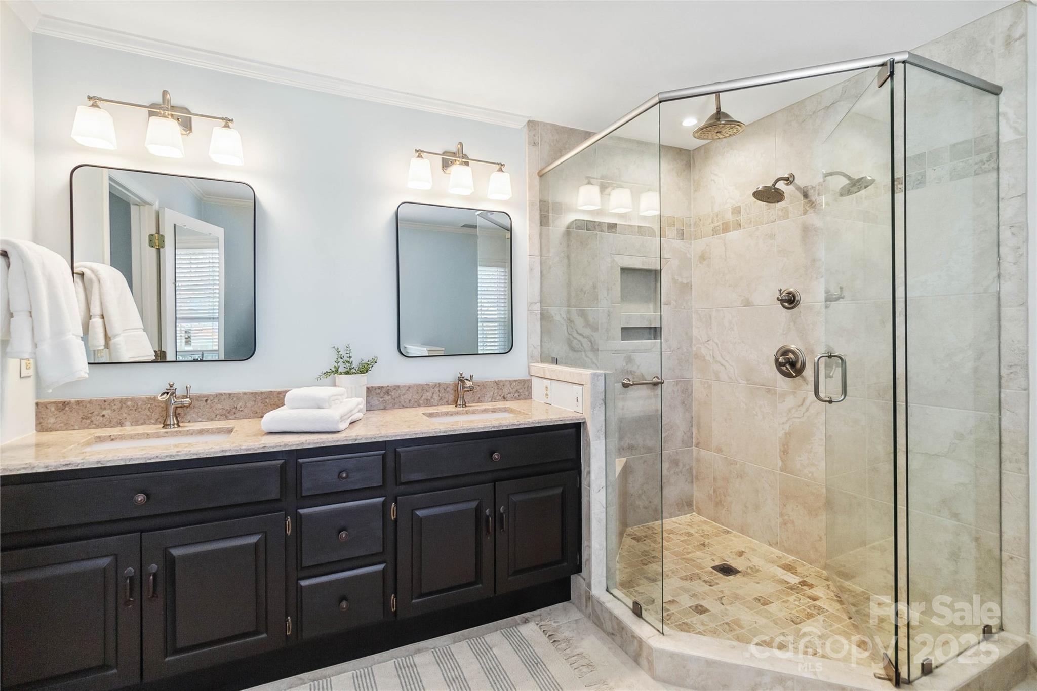 725 Stanhope Lane Matthews, NC 28105 - Photo 28 of 46 a bathroom with a double vanity sink mirror and shower