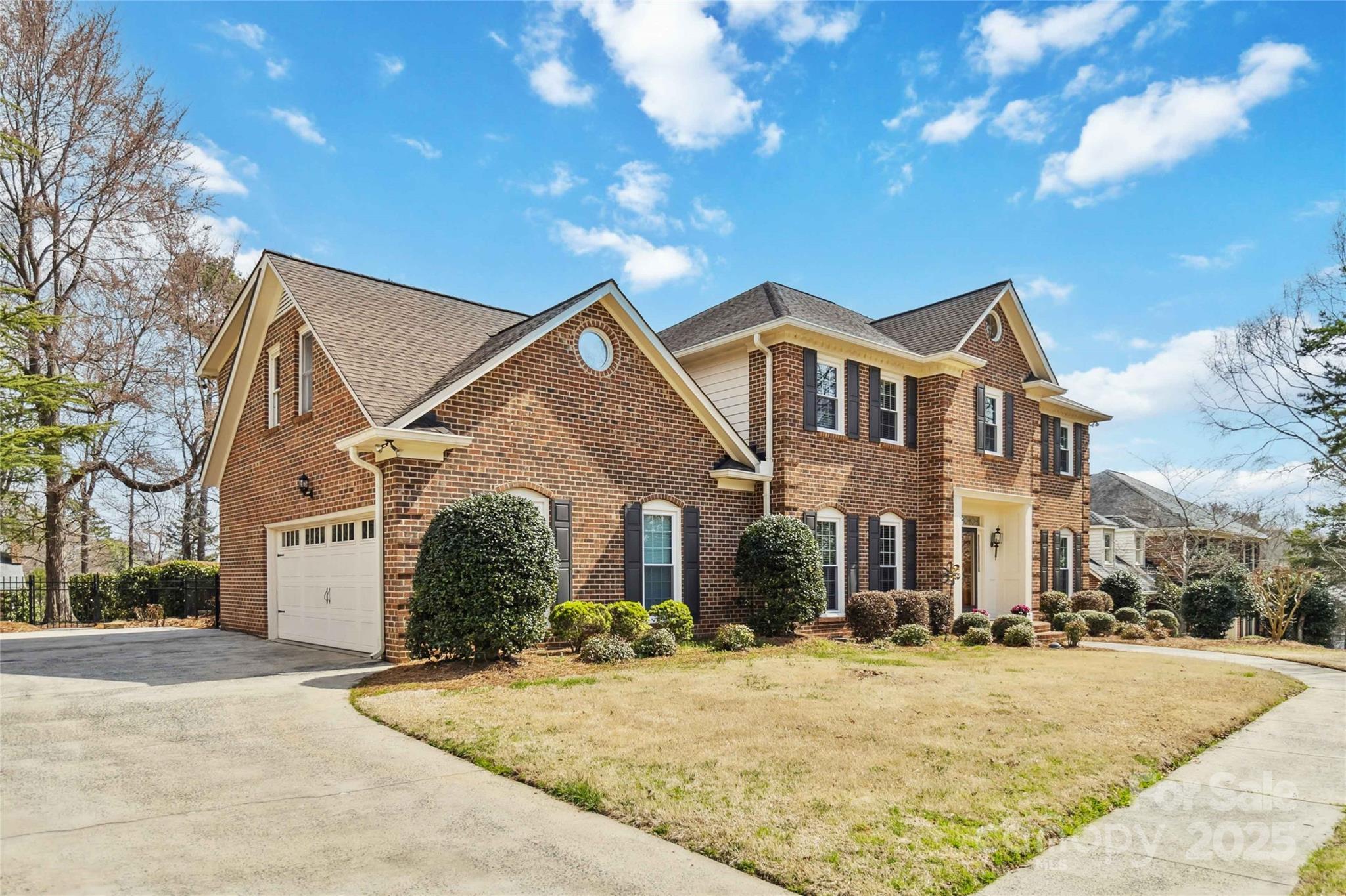 725 Stanhope Lane Matthews, NC 28105 - Photo 3 of 46 a front view of a house with a yard and garage