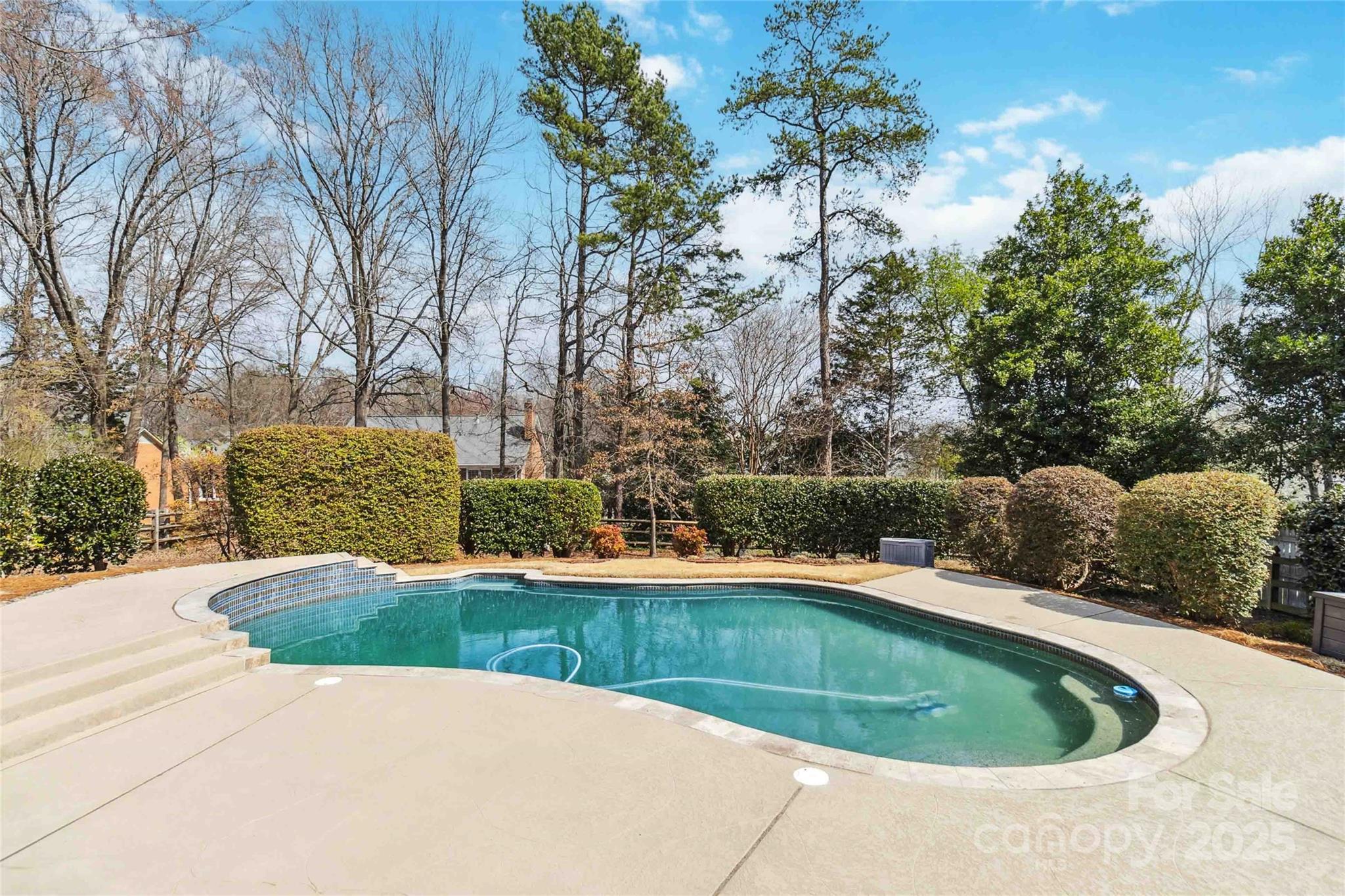 725 Stanhope Lane Matthews, NC 28105 - Photo 34 of 46 a view of a swimming pool with a yard