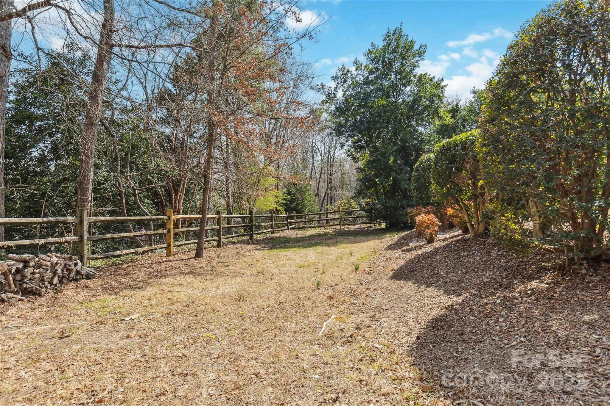 725 Stanhope Lane Matthews, NC 28105 - Photo 37 of 46 a view of a yard with wooden fence