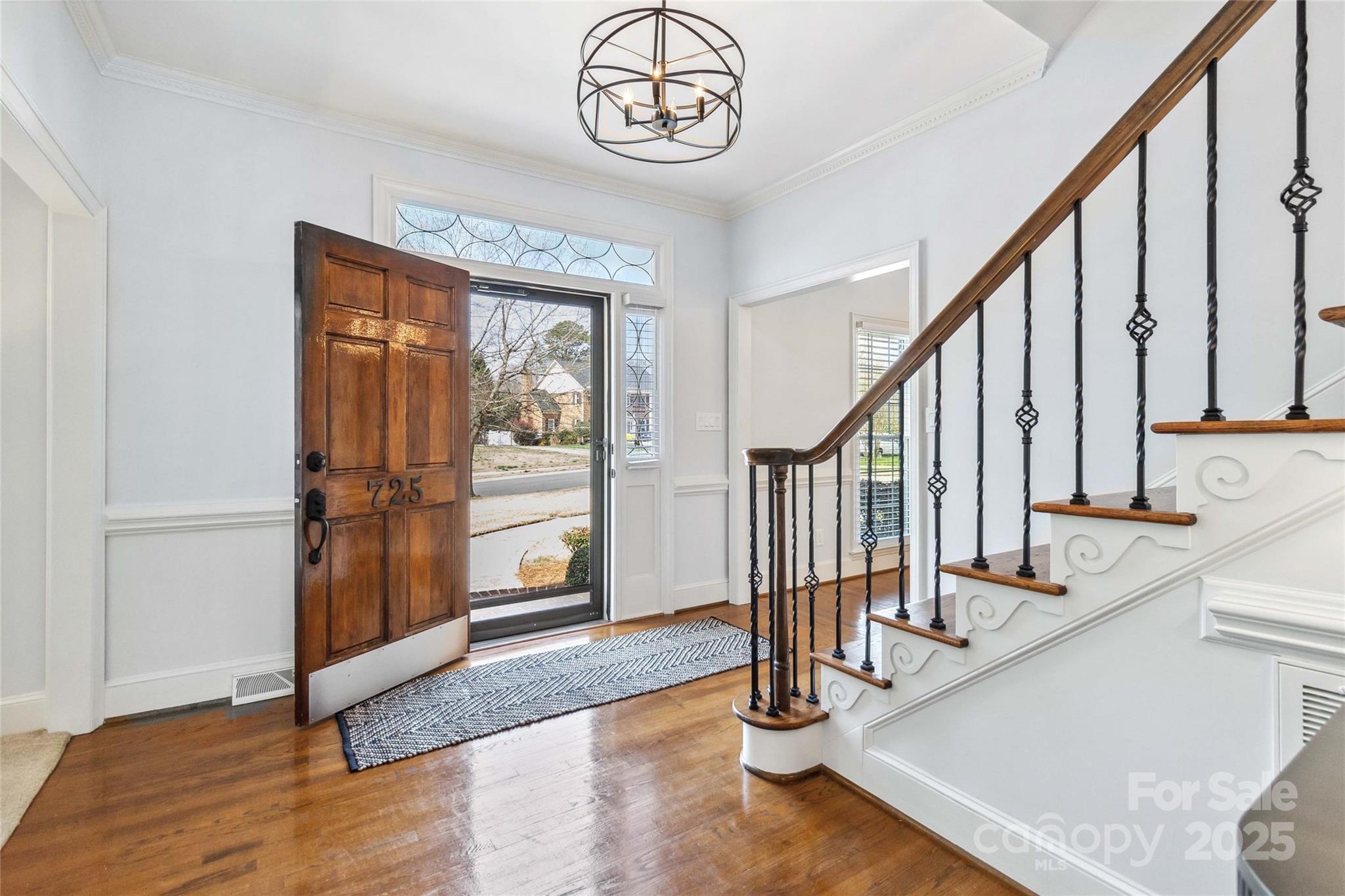 725 Stanhope Lane Matthews, NC 28105 - Photo 5 of 46 a view of an entryway with wooden floor