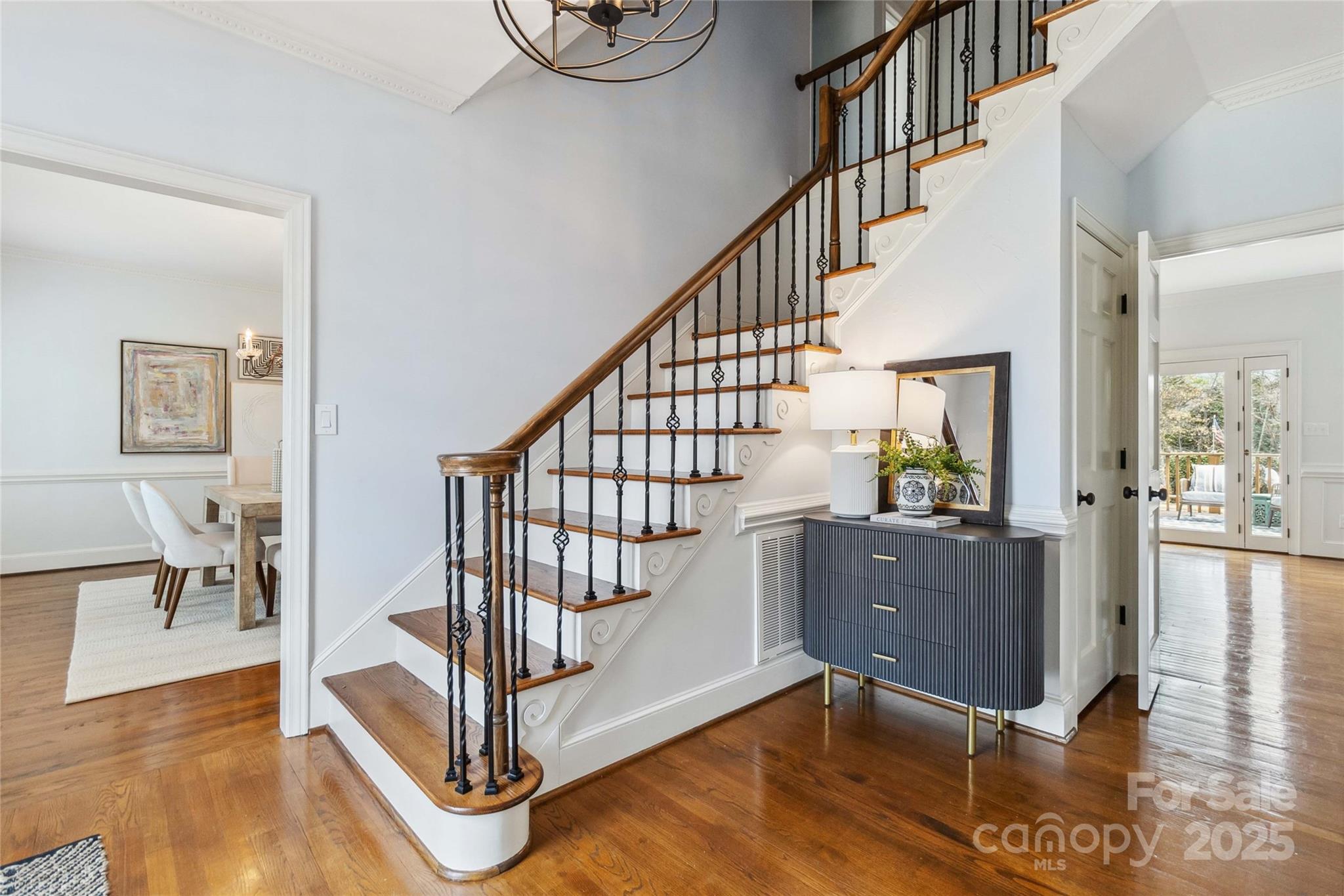 725 Stanhope Lane Matthews, NC 28105 - Photo 7 of 46 a living room with wooden floor and a table
