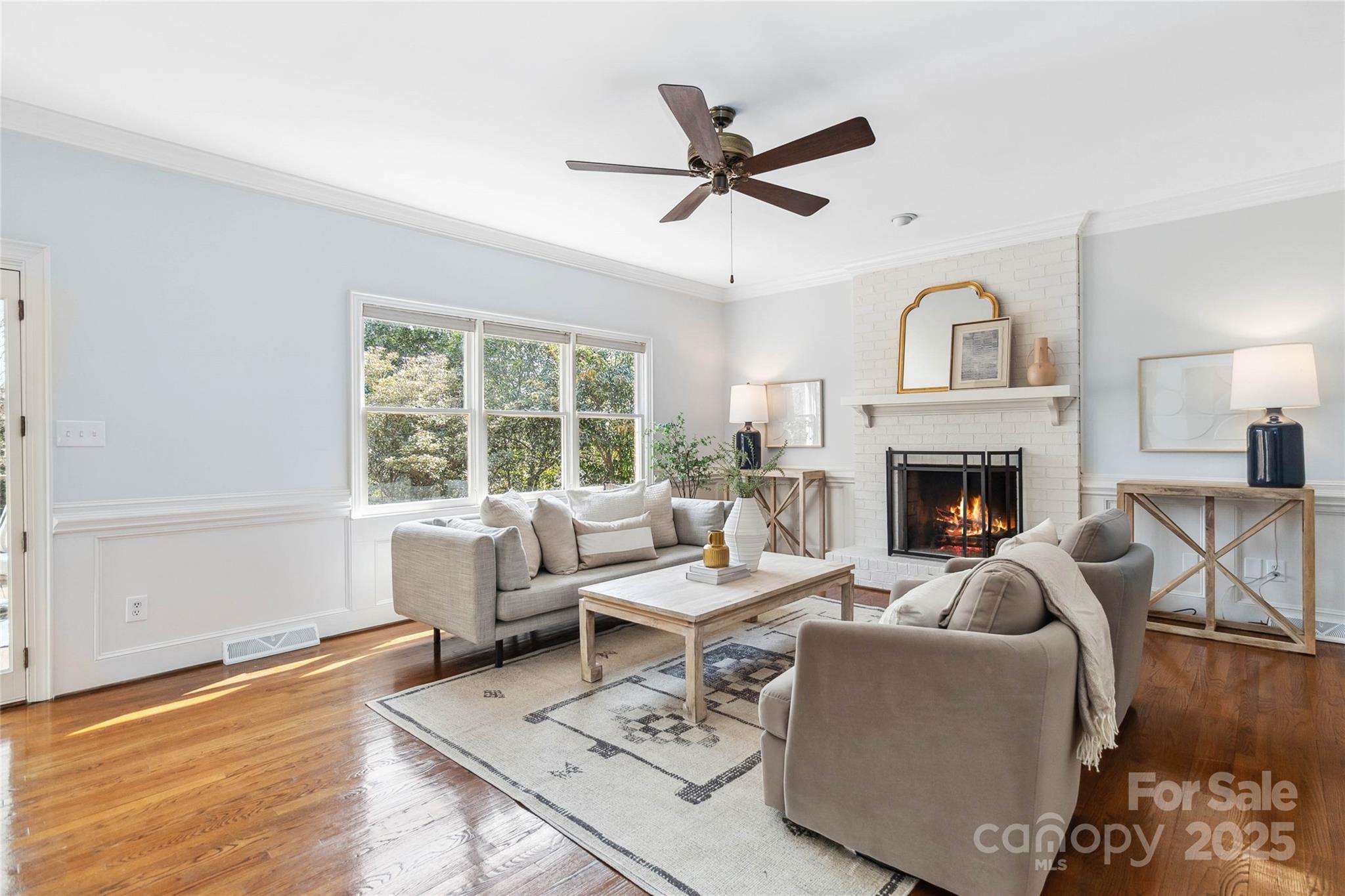 725 Stanhope Lane Matthews, NC 28105 - Photo 9 of 46 a living room with furniture and a fireplace