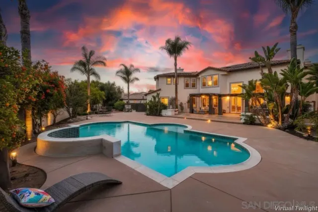 a view of a swimming pool with a patio