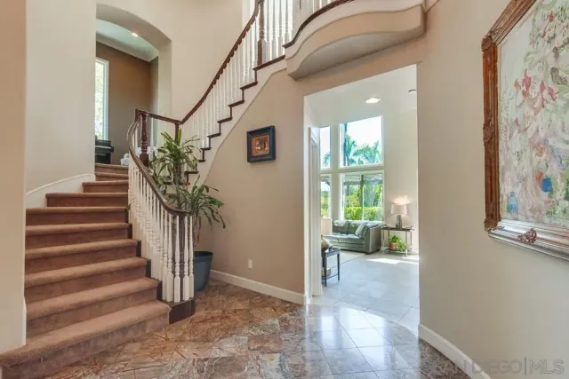 a bedroom with a bed a desk and chair