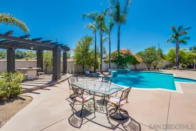 an aerial view of a house with a lake view