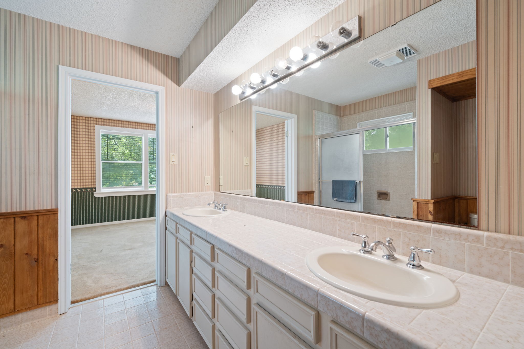 3541 Highway 159 La Grange, TX 78945 - Photo 21 of 45 a en suite bathroom with a double vanity sink and a mirror