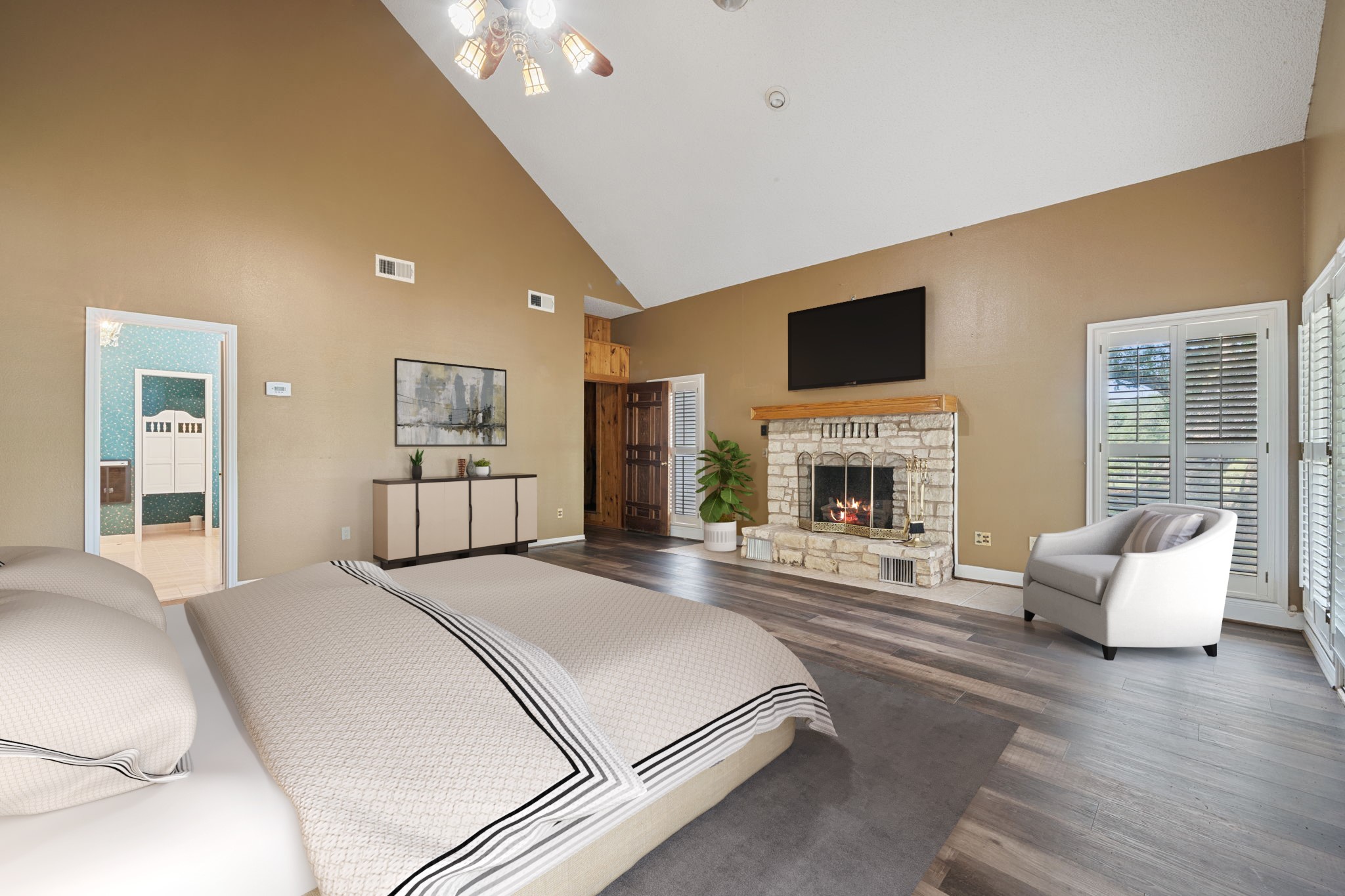 3541 Highway 159 La Grange, TX 78945 - Photo 28 of 45 a spacious bedroom with a balcony furniture and a fireplace