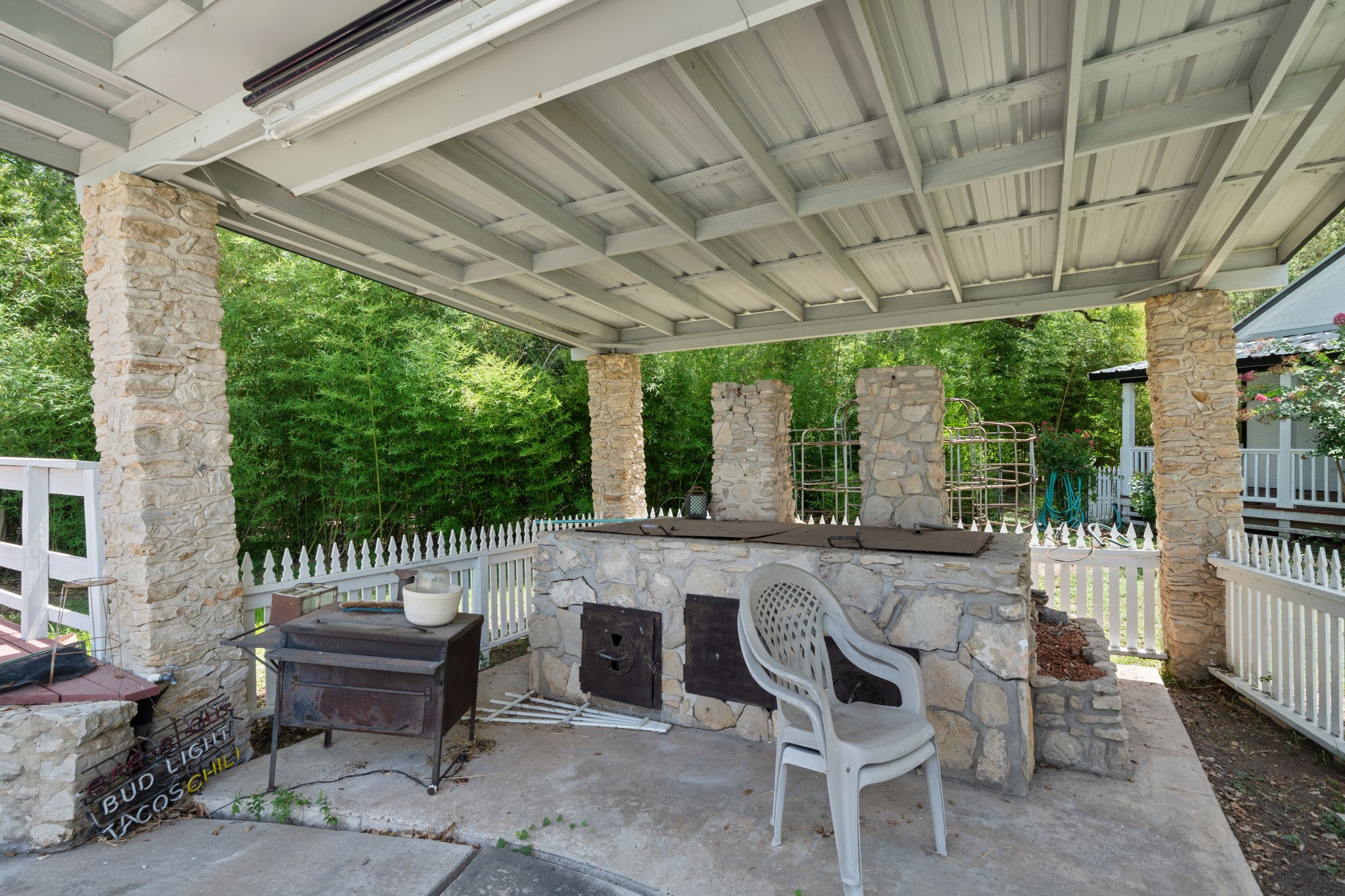 3541 Highway 159 La Grange, TX 78945 - Photo 36 of 45 a view of a patio with a table chairs and a couple of flower plants