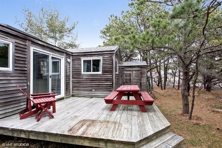 122 Shore Road, Unit 11 Truro, MA 02666 - Photo 15 of 15 a sitting area with furniture on wooden deck