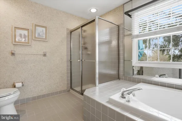 a bathroom with a tub and sink