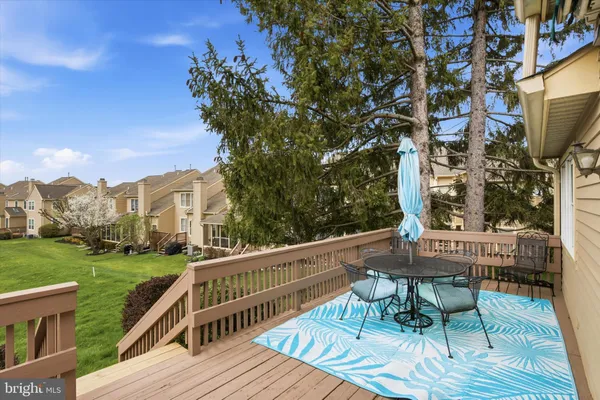 a view of balcony with wooden floor and outdoor seating