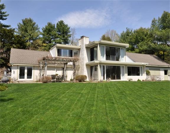 598 Lexington Road Concord, MA 01742 - Photo 1 of 15 a front view of a house with a garden