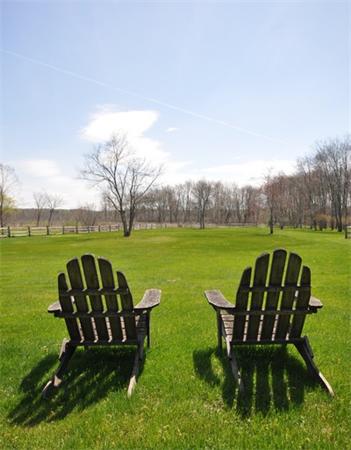 598 Lexington Road Concord, MA 01742 - Photo 14 of 15 a view of a table and chairs in the garden