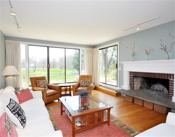 598 Lexington Road Concord, MA 01742 - Photo 4 of 15 a living room with furniture and a fireplace