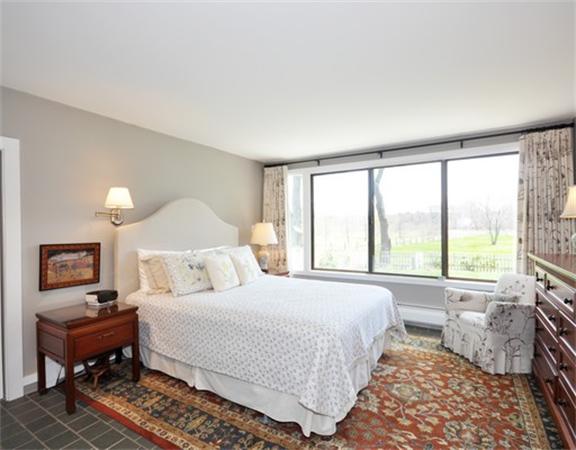 598 Lexington Road Concord, MA 01742 - Photo 7 of 15 a bedroom with a bed and a window